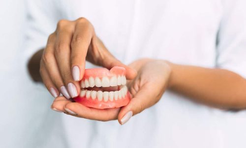 dentist-holding-dentures-1